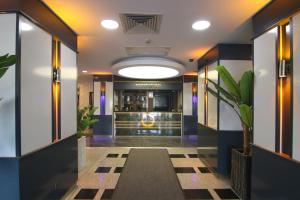 a hallway in a building with a lobby at Anatolia Park Hotel in Kayseri