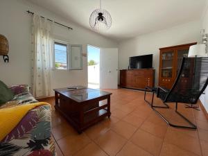 a living room with a couch and a coffee table at Casa Lia and friends in Playa Blanca