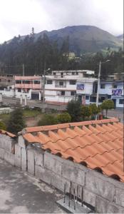 a view of a building with an orange roof at Casa Apartamento en un lugar encantador de la Naturaleza in Hacienda Chichavo