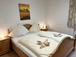 a bedroom with two beds with bows on them at Magnolia in Garmisch-Partenkirchen