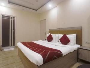 Postel nebo postele na pokoji v ubytování Hotel Grace, Karol Bagh, New Delhi