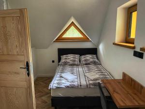 Ένα ή περισσότερα κρεβάτια σε δωμάτιο στο Domki : Franek, Tymek,Gabi