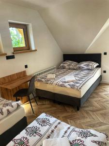 Ένα ή περισσότερα κρεβάτια σε δωμάτιο στο Domki : Franek, Tymek,Gabi