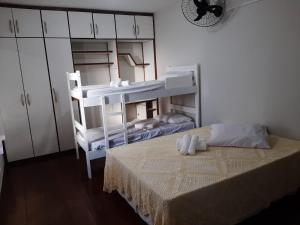a bedroom with a bunk bed and a white bunk room at Hostel Salvador Orquídeas in Salvador