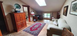 a living room with a couch and a table at Hotel Leeberghof in Tegernsee