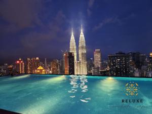 a view of the kuala lumpur city skyline at night at The Platinum 2 KLCC Premium Suite by Reluxe Kuala Lumpur in Kuala Lumpur