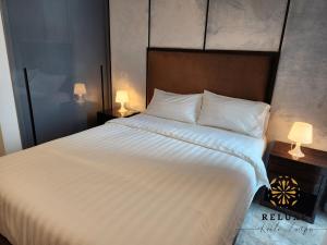 Voodi või voodid majutusasutuse The Platinum 2 Premium Suite by Reluxe toas