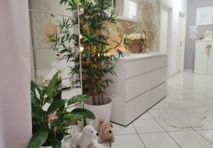 a hallway with plants and stuffed animals in a store at Nina in Baška Voda