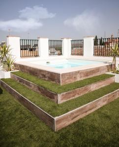 a swimming pool in the backyard of a house at CASA DE LA SEÑORA in Palma del Río