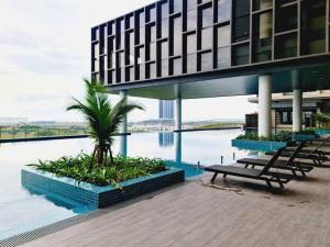 a building with a view of a body of water at New! Bali 5-8pax Melaka Town @ Play View Condo in Melaka