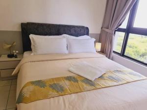 a bedroom with a large bed with a large window at New! Bali 5-8pax Melaka Town @ Play View Condo in Melaka +32 photos