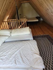 Postel nebo postele na pokoji v ubytování Norrekås Beach Studios