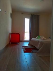 Ένα ή περισσότερα κρεβάτια σε δωμάτιο στο Casa Vacanze da Vita e Filippo