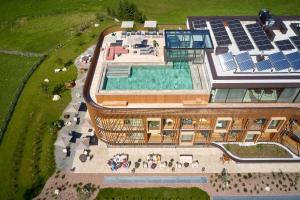 an overhead view of a building with a swimming pool at Hotel Badia Hill in Badia