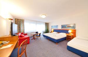A bed or beds in a room at Hotel Boulevard