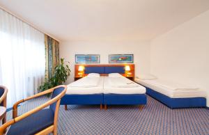 A bed or beds in a room at Hotel Boulevard