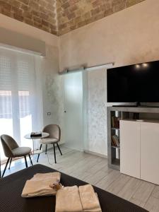 TV a/nebo společenská místnost v ubytování B & B Via Cavour
