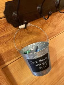 a bucket on a table with a sign on it at Elegant & Cozy Cabin Near Pigeon Forge in Sevierville