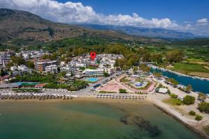 an aerial view of a beach with a red balloon at Golden sea suites in Georgioupolis