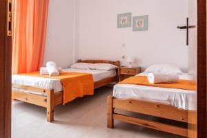 Posteľ alebo postele v izbe v ubytovaní Mike's Apartments