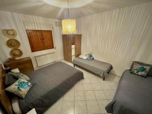 Postel nebo postele na pokoji v ubytování Villa Connie