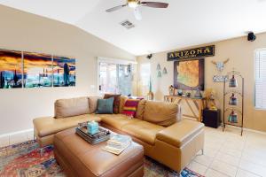 a living room with a couch and a table at Gold Canyon Getaway in Gold Canyon