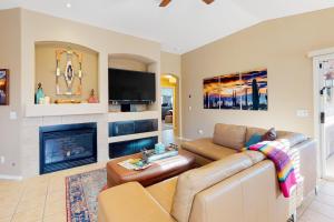 a living room with a couch and a fireplace at Gold Canyon Getaway in Gold Canyon