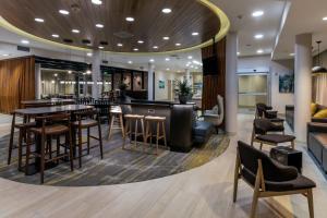 a bar in a hotel lobby with chairs and tables at SpringHill Suites by Marriott Jackson Hole in Jackson