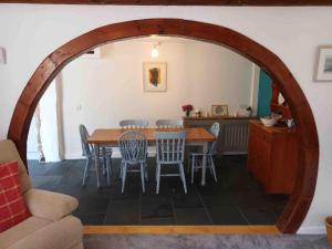 a dining room with a table and chairs at The Old Barn in St Ives