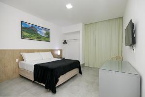 TV a/nebo společenská místnost v ubytování Yak Beach Hotel Natal