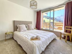 Zdjęcie z galerii obiektu Appartement spacieux rénové ski aux pieds, balcon, parking, Wi-Fi - FR-1-688-50 w Méribel