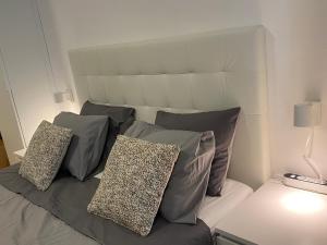 a bedroom with a bed with pillows on it at Studio La Carihuela in Torremolinos