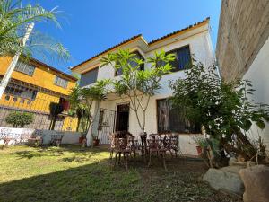 a table and chairs in front of a house at Casa Estrella Oaxaca in Oaxaca City
