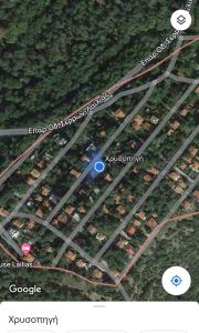 a map of a parking lot with a blue circle at vila Foteini in Serres