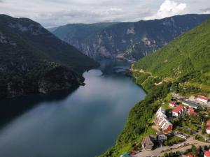 an aerial view of a lake in the mountains at Apartman Ognjenović in Pluzine