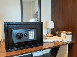 a small television sitting on a desk in a room at Tambuli maribago residence condominium in Maribago