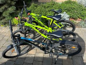 two bikes parked next to each other on a sidewalk at Forest paradise in Koprivnica