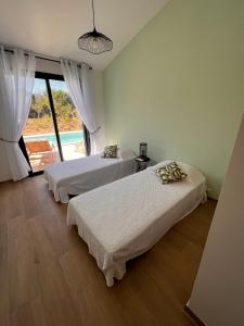 Ένα ή περισσότερα κρεβάτια σε δωμάτιο στο Villa Ena
