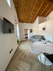 a living room with a white table and chairs at Luxuria in Iglesias