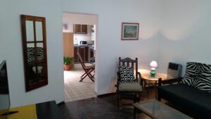 a living room with a couch and a table at DC Alquileres Temporarios in Santa Fe