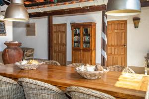 a dining room table with baskets on top of it at Bonaire 2 Stay Playa in Kralendijk