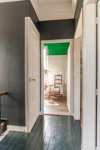 an open hallway with a chair in a room at Maison Corbionne - Au cœur du Perche in Condeau