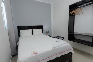 Ένα ή περισσότερα κρεβάτια σε δωμάτιο στο GOYA HOTEL