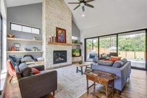 a living room with two couches and a fireplace at New House Cool Pool 4B/3.5B in south Austin in Austin