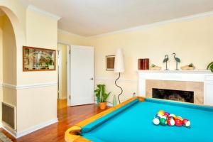 a living room with a pool table at Spacious Renovated Petaluma Home- Pool Table, Fire Pit, Parking in Petaluma