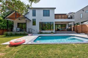 a house with a swimming pool in the yard at New House Cool Pool 4B/3.5B in south Austin in Austin