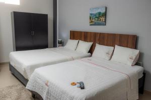 Ένα ή περισσότερα κρεβάτια σε δωμάτιο στο GOYA HOTEL