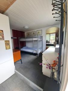 a bedroom with two bunk beds in a room at Paradiset in Kulltorp