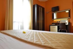 Postel nebo postele na pokoji v ubytování Hotel Rosignano