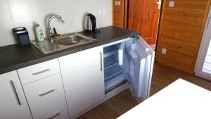 Köök või kööginurk majutusasutuses Bungalow Camping Jacuzzi & Sauna